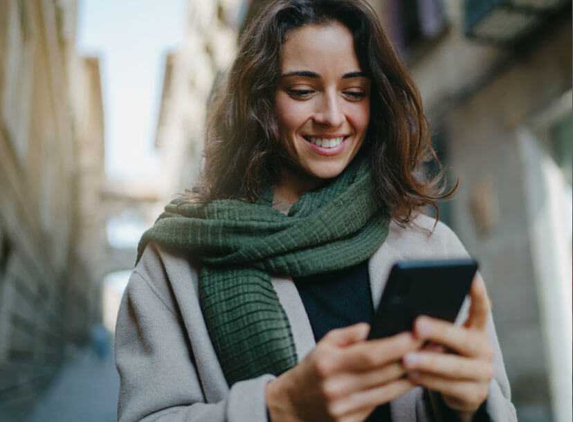 Picture of Woman Smiling Checking Phone