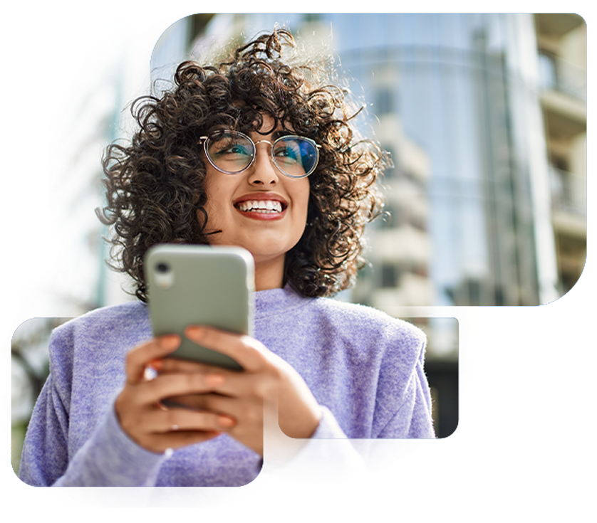 Smiling woman holding mobile phone